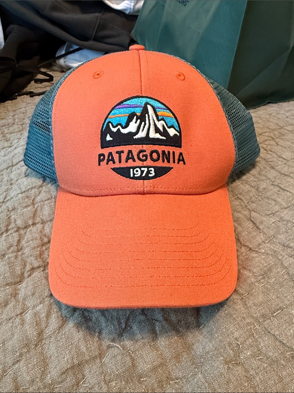NWOT. Patagonia Orange Front with Teal Mesh Trucker Hat
